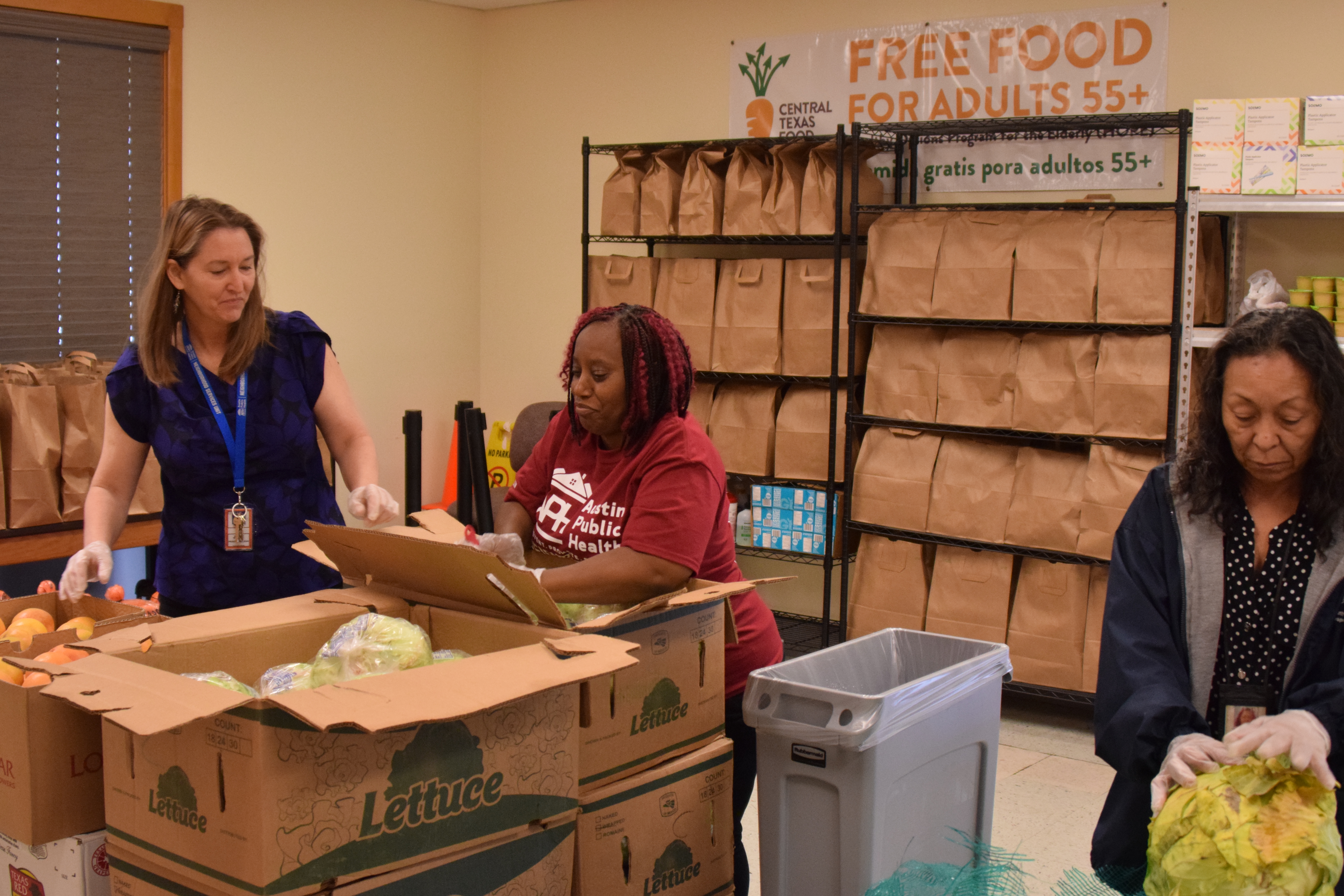 The team at the South Austin Neighborhood Center preparing packages of food for the community.