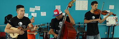Education Teachers helping students learn about music