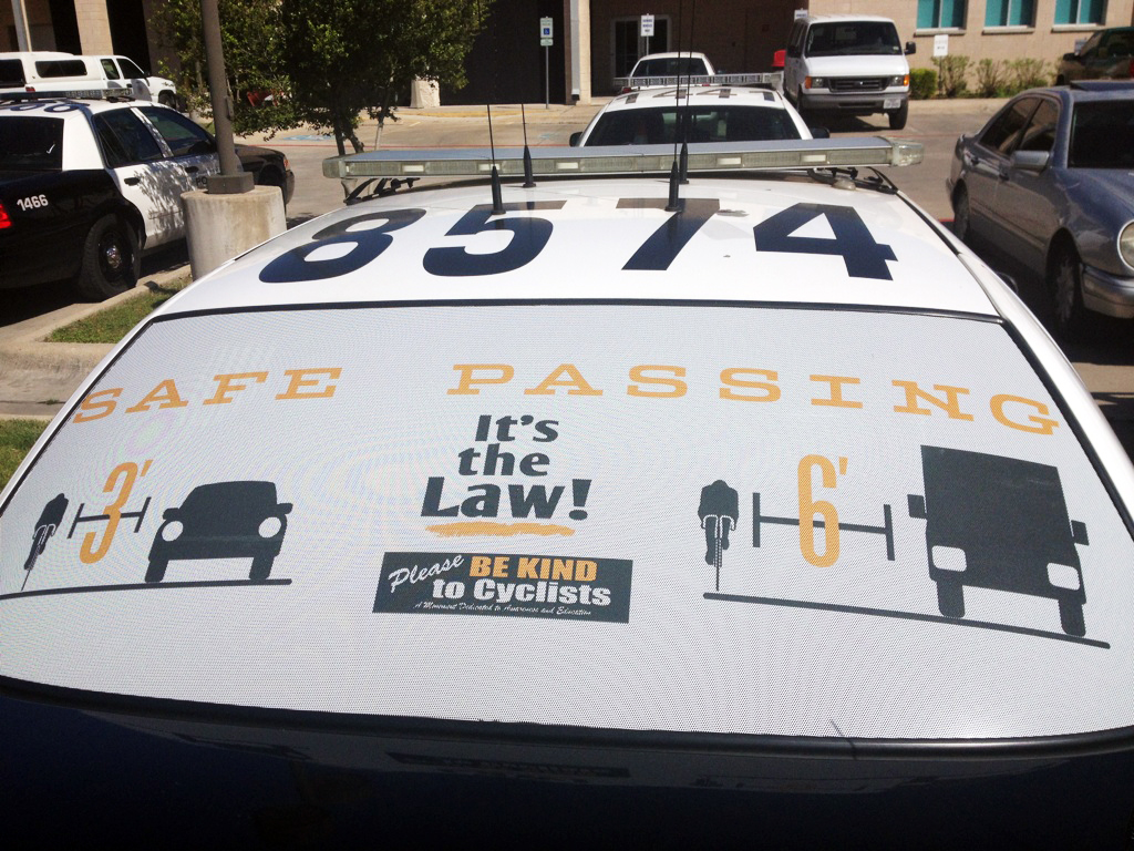 Give 3 feet for safe passing window wrap on Austin Police Department patrol car.