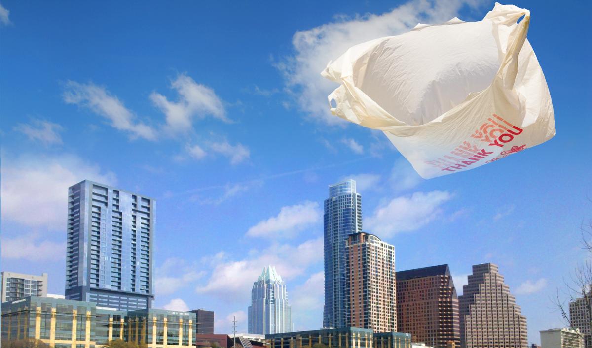 Plastic bag blowing in wind with Austin skyline