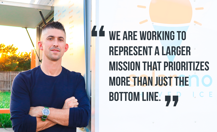 Tom with arms crossed next to solar trailer. Quote reads "We are working to represent a larger mission that prioritizes more than just the bottom line." 