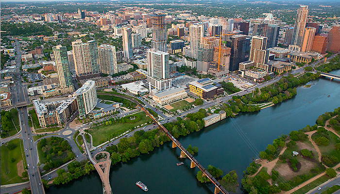 photo of downtown from lady bird lake walkway