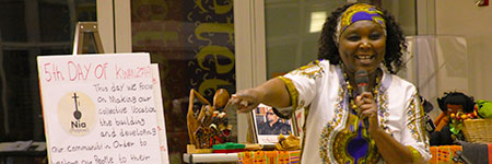 Photo of Elizabeth Kahura for the Kwanzaa Celebration of Nia at the George Washington Carver Museum Cultural and Genealogy Center in Austin
