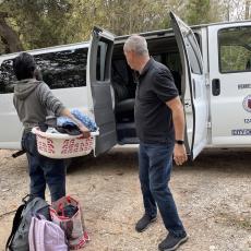 Individual moving from encampment to bridge shelter