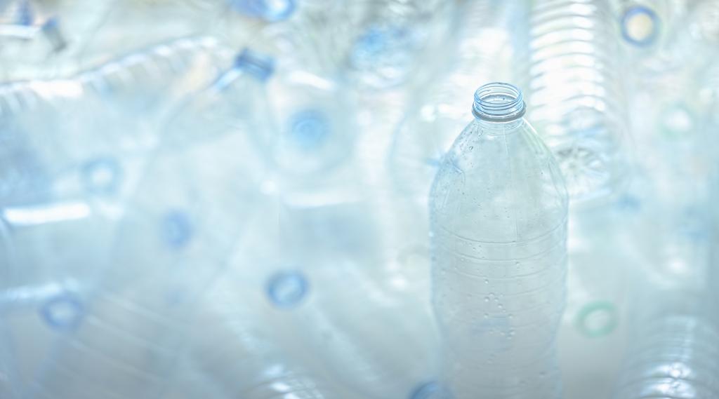 A close up image of multiple plastic water bottles.
