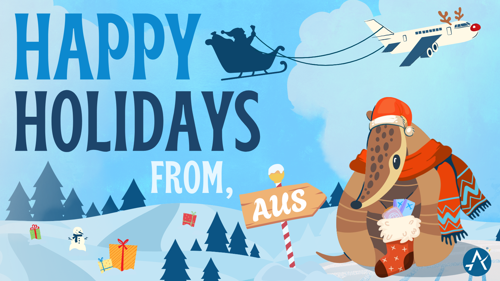 An illustration depicting a festive holiday scene with the text "Happy Holidays From AUS" in bold, cheerful lettering. The background features snowy hills adorned with evergreen trees, wrapped presents, and a playful snowman. Santa's sleigh, accompanied by a reindeer-themed airplane, flies across a bright, wintry sky. In the foreground, an armadillo wearing a Santa hat and a cozy red scarf holds a stocking stuffed with holiday surprises, standing next to a candy-cane-striped signpost reading "AUS." A fun an