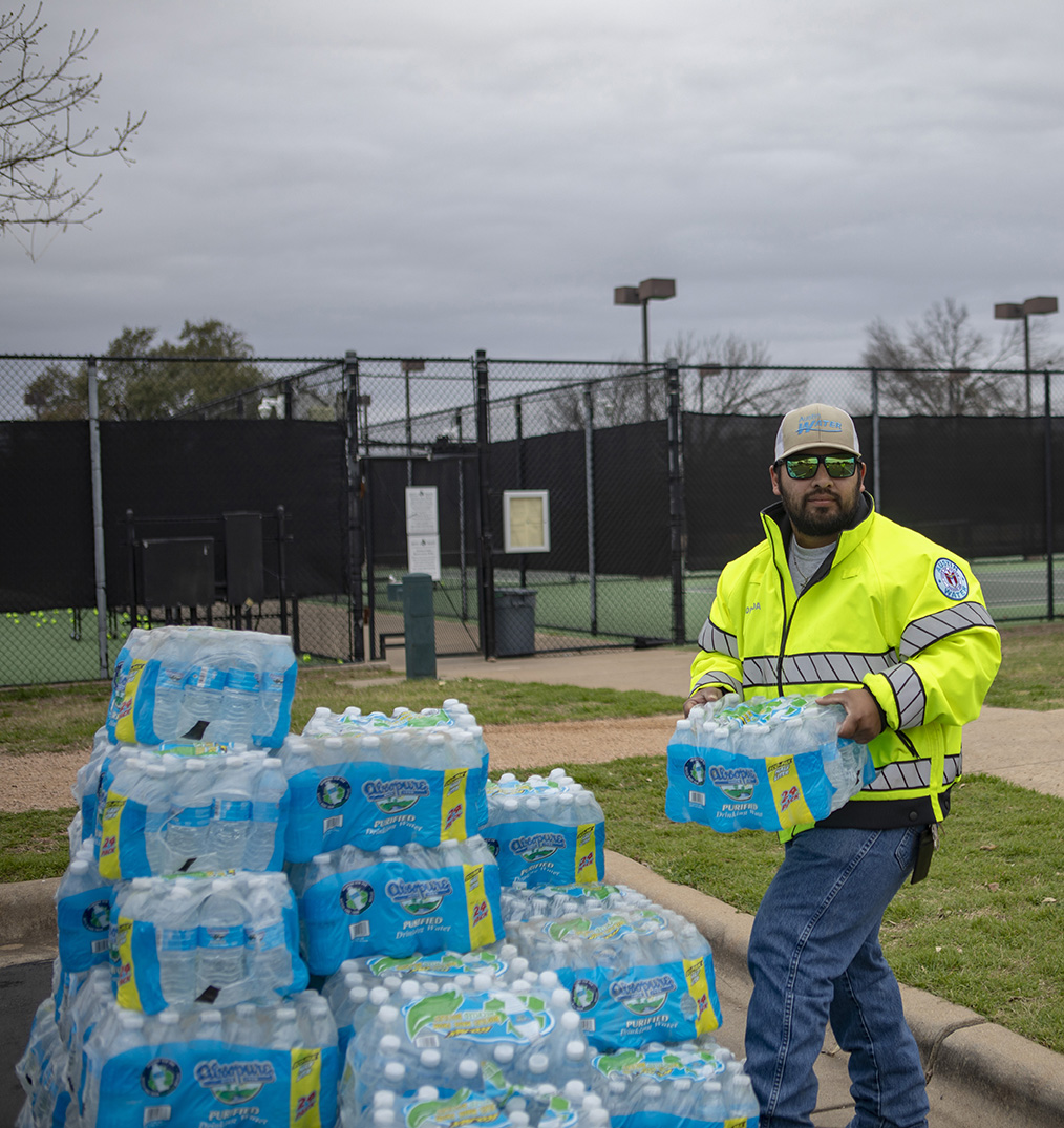 Water being handed out by Austin Water employee