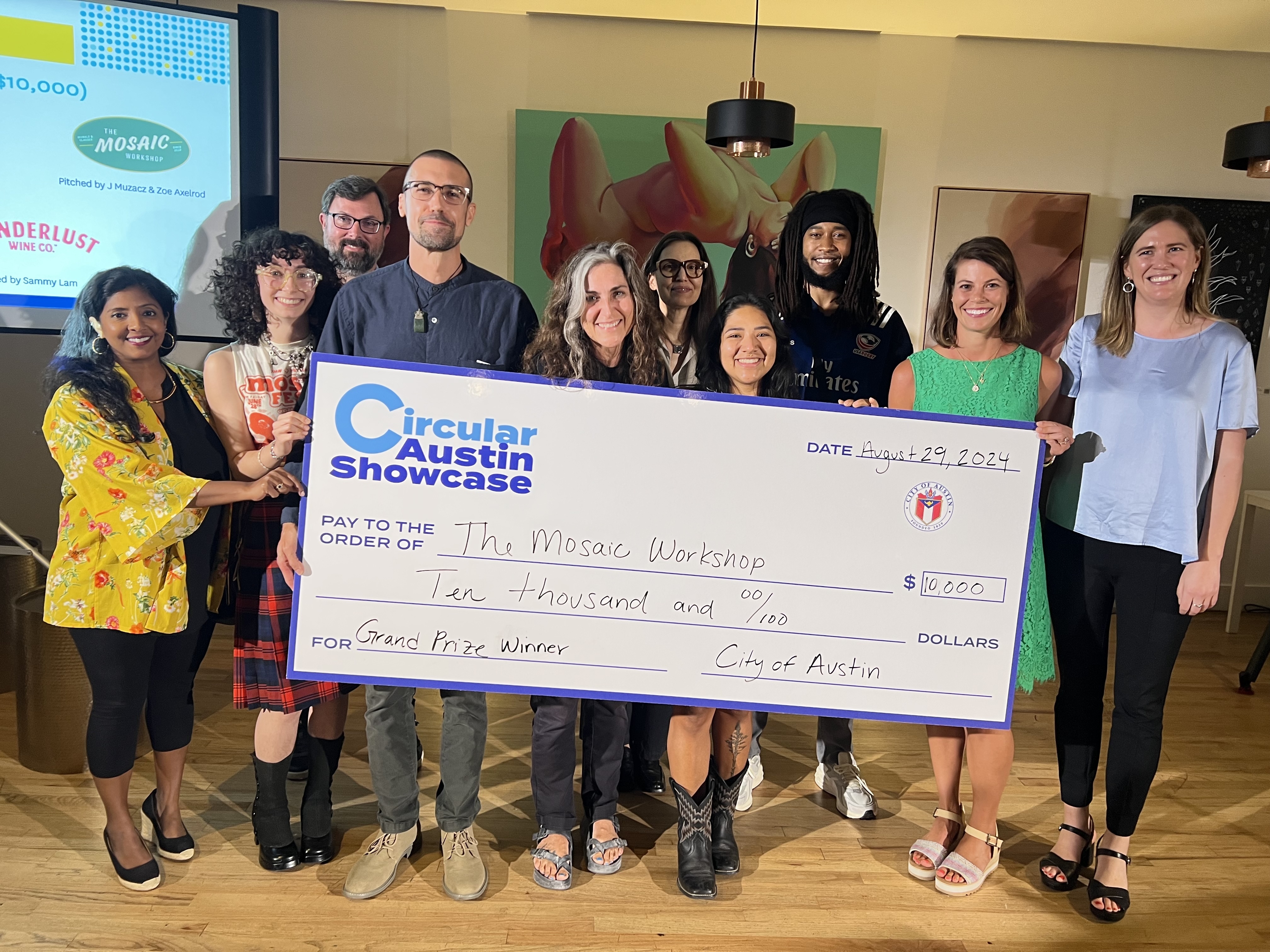 The Mosaic Workshop accepts the cash prize at the Circular Austin Showcase from Maddie Morgan and the judging panel. 