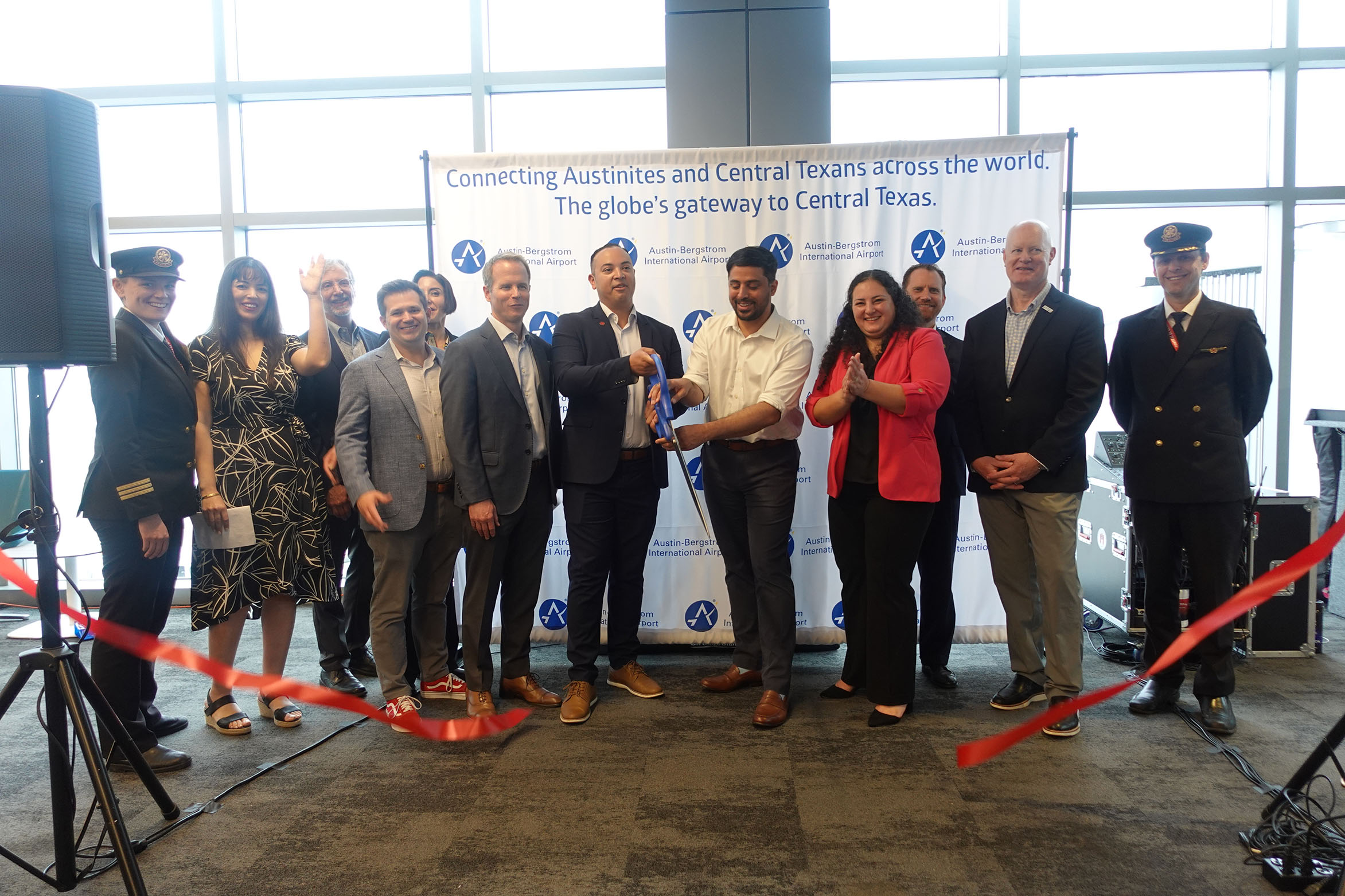 From Left to Right: Air Canada Pilot, Miriam Bouziri, with the Delegation of Quebec, Tim Fennell, with Travel Texas, Ozlem Toplu, with the Delegation of Quebec, Brian Haley, with the Canadian Consul General, Ed Latson, with Opportunity Austin, Alfredo Hurtado, with Air Canada, District 9 Councilmember Zohaib Qadri, Ghizlane Badawi, with the Austin-Bergstrom International Airport, Jeremy Martin, with the Greater Austin Chamber of Commerce, Tom Noonan, with Visit Austin, and an Air Canada Pilot.