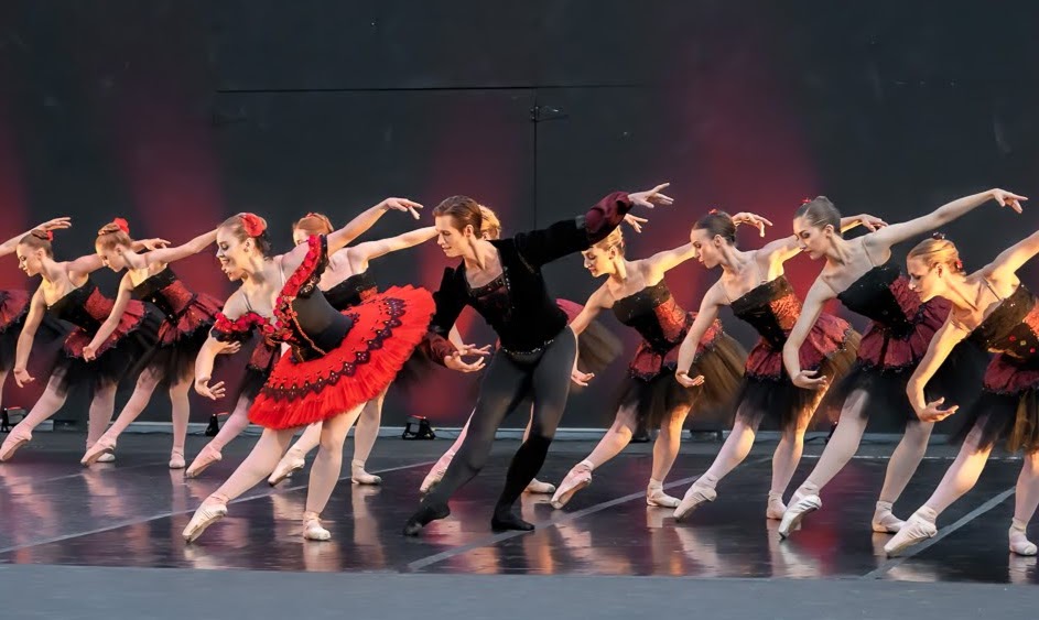A group of ballet dancers pose onstage, courtesy of Austin Dance Ensemble.   