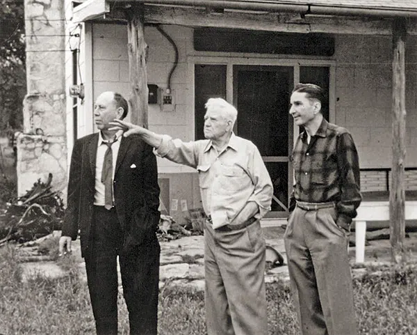 Fred Gipson, J. Frank Dobie, and Joe Austell Small Sr. in front of a building