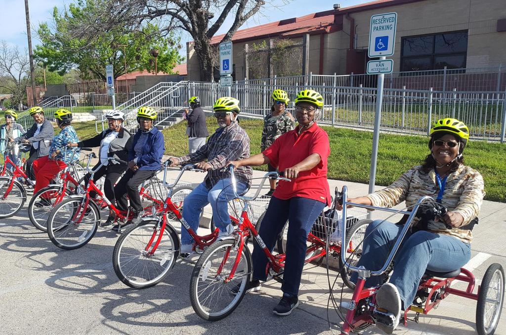 Group of citizens on city bicycles