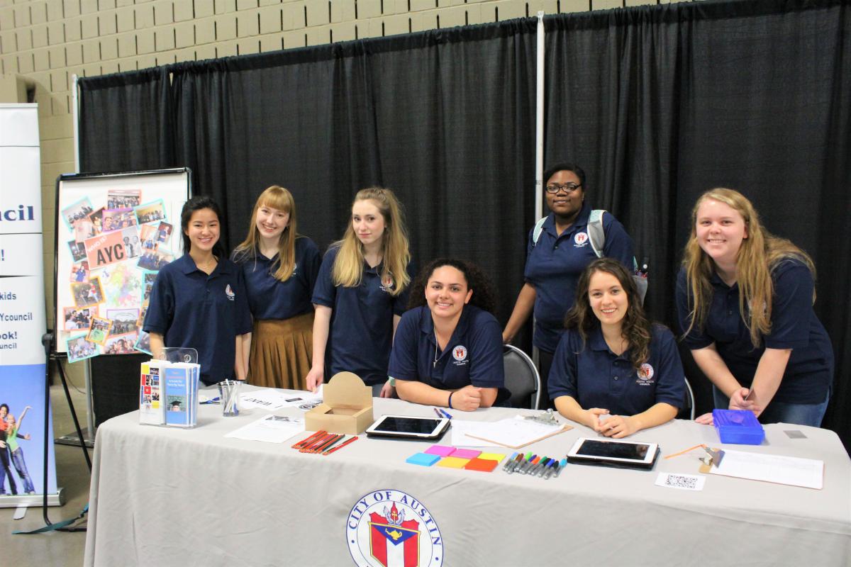 Austin Youth Council members hosting their booth at Youth Career Fest