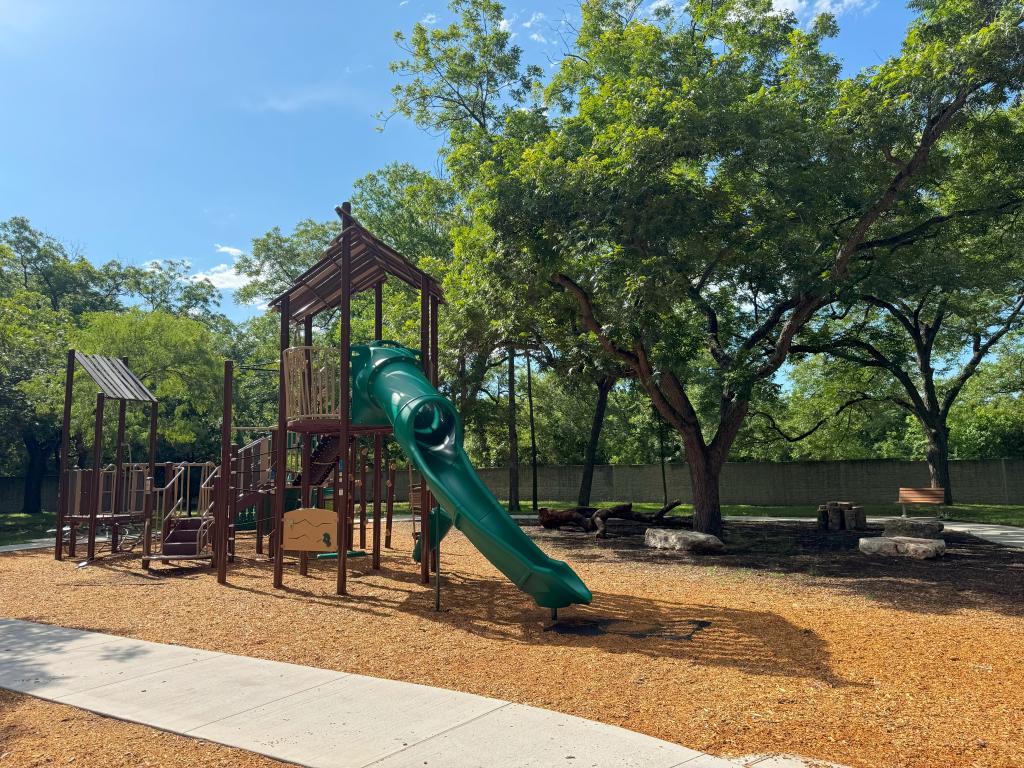 New playground structure at Davis White Neighborhood Park has a slide and several climbing elements.