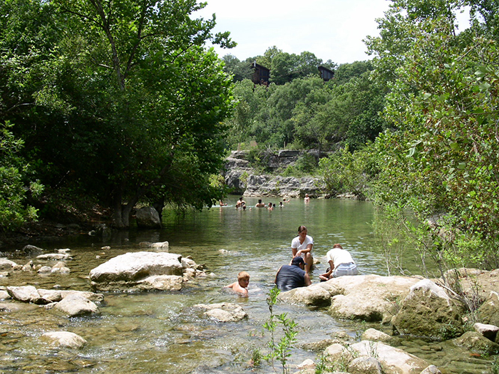 People playing in the creek.