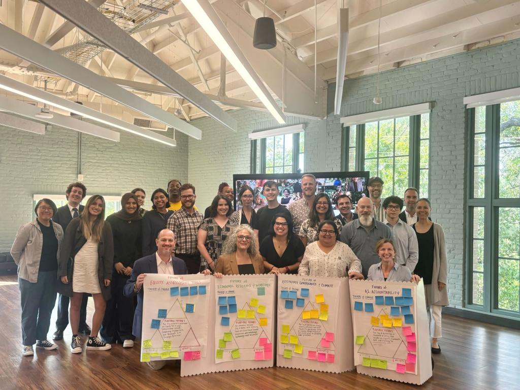 A group photo of attendees at the OGP meeting