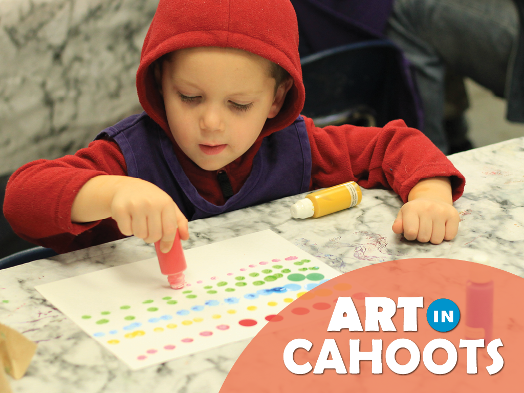 An image of a child creating art with paint pens and the text 'Art In Cahoots'