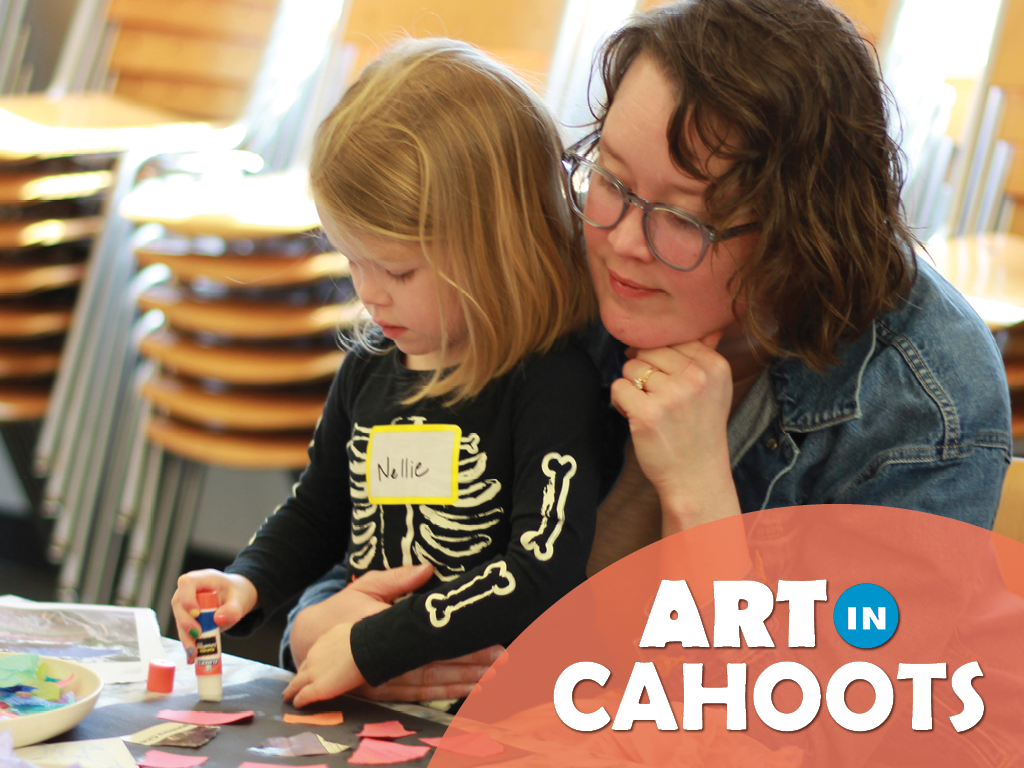 A photograph of an adult and child at a table together. The child is using glue and paper to make a collage. On the image is the text 'Art In Cahoots'