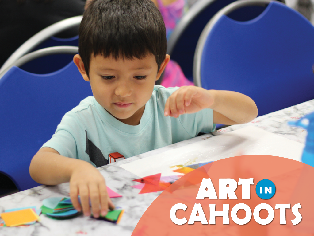 An image of a child creating art with tissue paper triangles and the text 'Art In Cahoots'