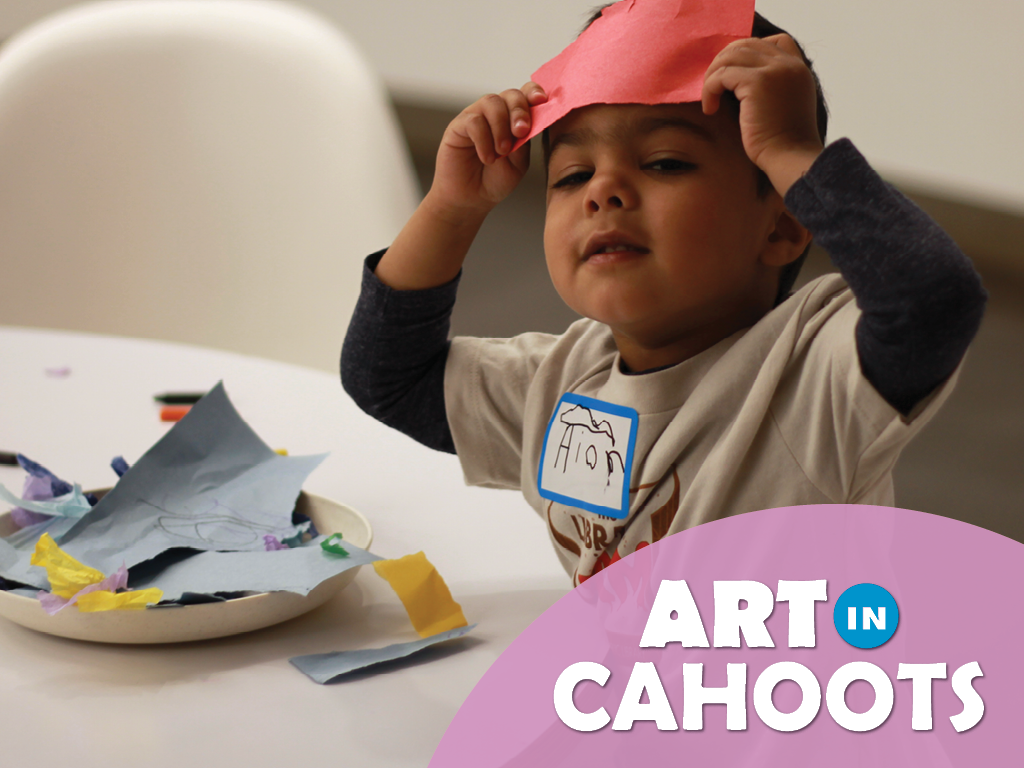 An image of a child playing with paper and the text 'Art In Cahoots'