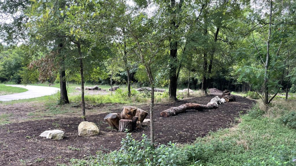 Logs, stumps, and rocks in the Walnut Bluffs nature play area