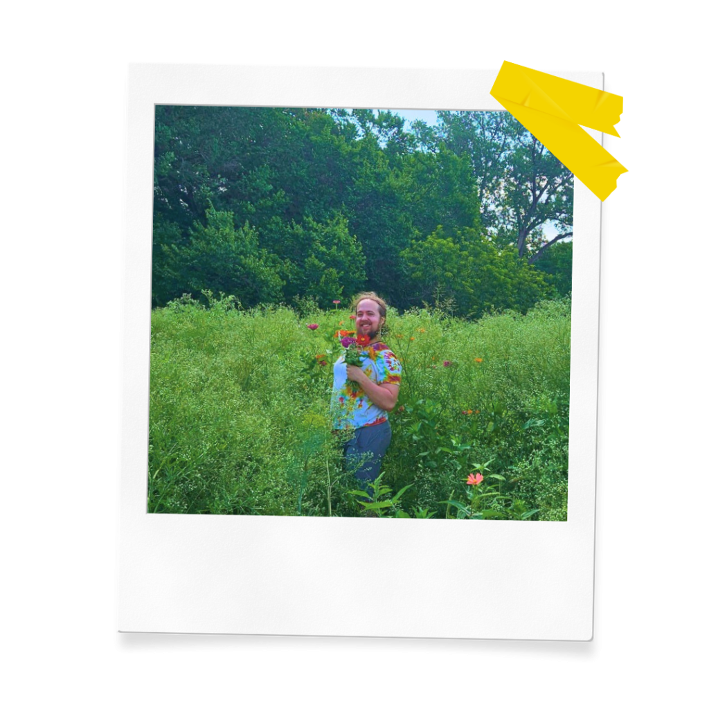 A polaroid of a person holding wildflowers at Urban Roots Farm.