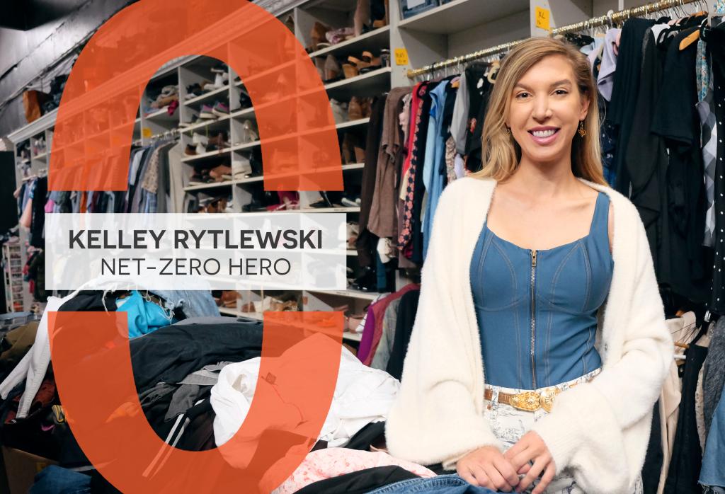 Kelley Rytlewski stands next to a large pile of clothes and in front of stocked shelves. A graphic reads, "Kelley Rytlewski: Net-Zero Hero."