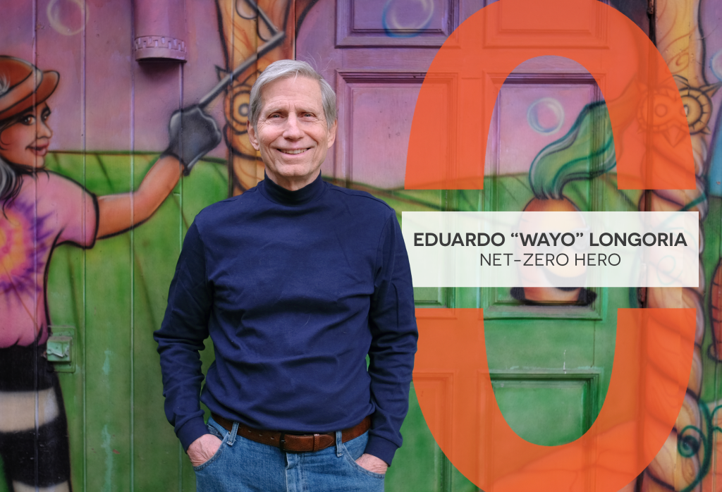 Eduardo "Wayo" Longoria smiles as he stands in front of an airbrushed mural outside the entrance of Casa de Luz.