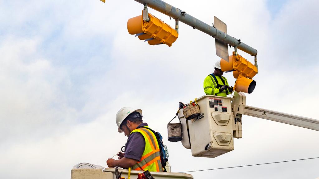 City of Austin employees service a traffic signal.