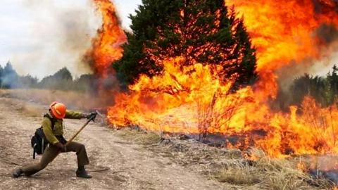 Firefighter putting out fire