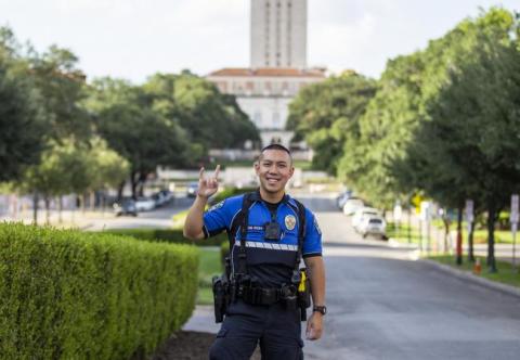 officer in front of the University of Texas