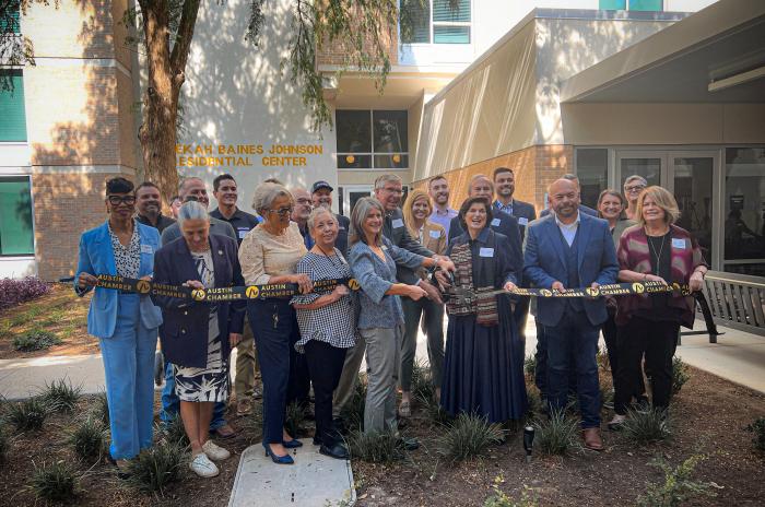 The Rebekah ribbon cutting City and community leaders participate in a ribbon-cutting ceremony at the Rebekah Baines Johnson Residential Center grand reopening.