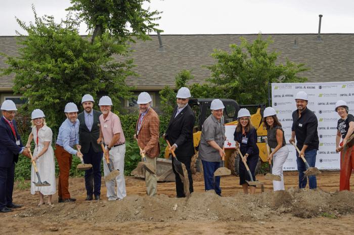 Image of partners and developers with shovels and hard hats to commemorate the groundbreaking ceremony for the new residence,The Lancaster.