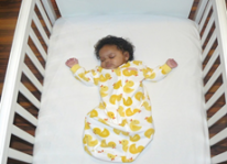 Baby sleeping in a crib